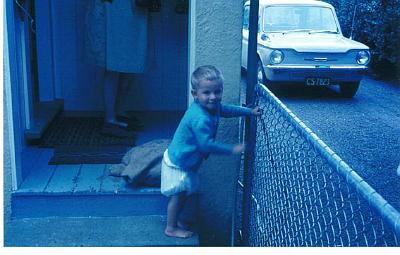 04-TISCO_Imp.jpg - Jim Pye about two with TISCO Hillman Imp in background. Back door 274 High Street Dannevirke