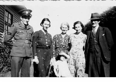 22-MILLER_Group.jpg - L to R Doug Miller, Gwenyth Graham Stewart nee Miller,
Elizabeth Miller nee Gichard, Jean Miller nee
Blomfield and John Graham Miller, Judith Stewart age 3
years in front taken at the Hatchery House Pownall
Street, Masterton, June 1939 - 1940